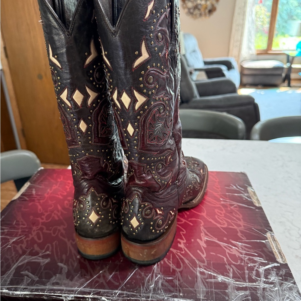 Lucchese Black and Brown Heeled Boots with Intricate Stitching